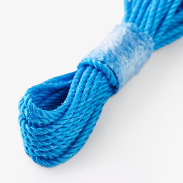 Blue polypropylene rope wound tightly, visible texture and weave, high-quality appearance.
