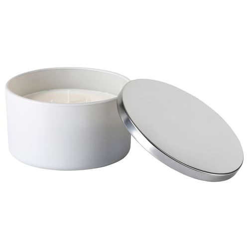 White metal lidded candle jar with cotton wick. Modern, minimalist design.