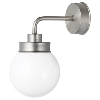 A FRIHULT silver wall lamp with a round glass shade.