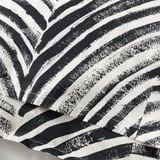Black and white striped pillowcase with irregular patterns. ;