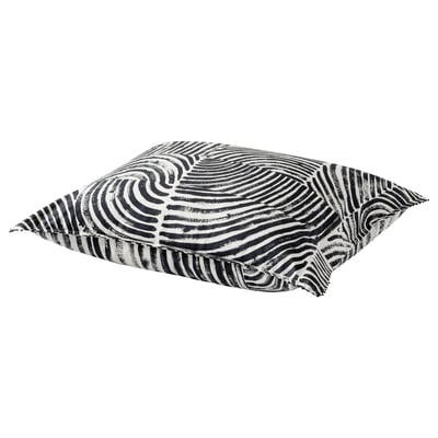 Black and white patterned pillow with wavy lines, square shape, and french knots at corners.