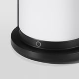 Close-up of modern matte black lanterns top edge, smooth, sleek design.
