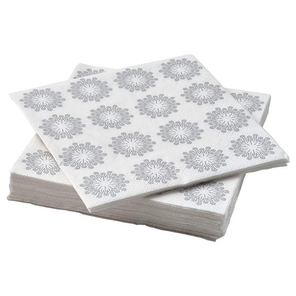 Stack of white star-patterned FRÖJDA napkins, made of absorbent three-ply paper.