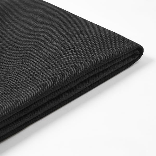 Black fabric folded neatly, showcasing smooth texture and precise stitching, ideal for outdoor cushion cover.