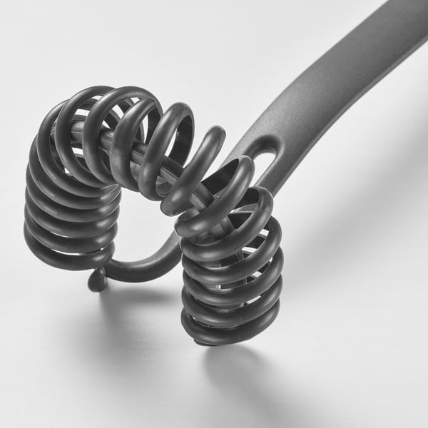 Black kitchen utensil with spiral design made of reinforced polyamide for non-stick cookware.