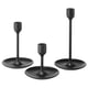 Three black modern candlesticks in varying heights, sleek aluminum design with felt pads for stability.