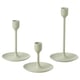 Option: Three light green candlesticks in varying heights, simple modern design, made of aluminum with felt pads, arranged in a triangle.