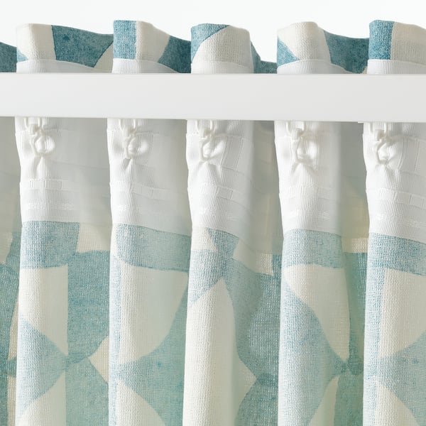 Geometric pattern curtains with rod pocket. Semi-sheer, cotton/jute blend for light privacy.