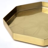 Octagonal gold tray with engraved floral pattern, sturdy edge, and polished finish.