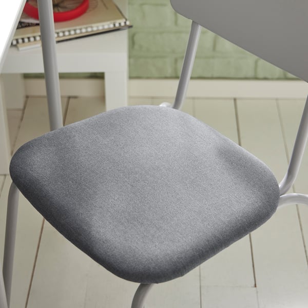 A modern, grey GRÅSALA chair with a padded seat and a sleek metal frame, designed for comfort.
