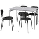 Option: A modern set including a light grey rectangular table and four black chairs with metal frames and upholstered seats, designed for compact spaces.