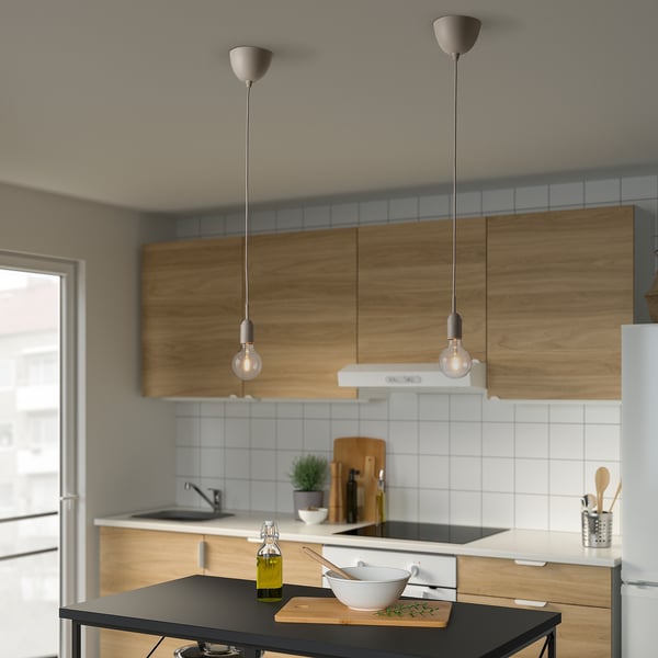 Modern hanging lamps over kitchen island.