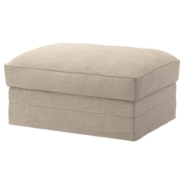Depicts a beige-colored, rectangular-shaped footstool with a padded, textured fabric cover. It has a simple, modern design with smooth, rounded edges.