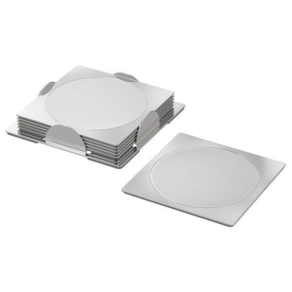 Ten silver round metal coasters, stacked with holder, for protecting tables and reducing noise from glasses and mugs.
