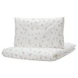 White GULDVÄVARE baby bedding with pink flowers, organic cotton duvet and pillowcase.