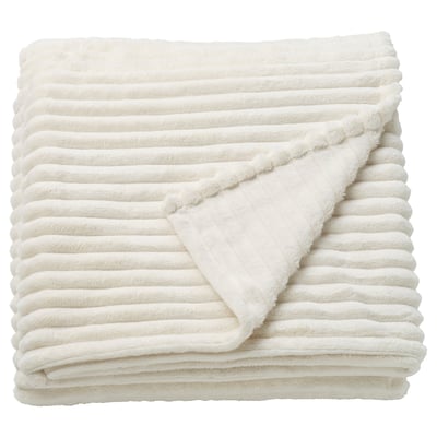 A folded GULLSTRÅLE blanket in white. Made from 100% recycled polyester, it a soft, textured stripe design.