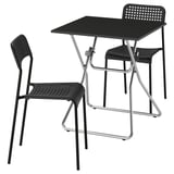 Black GUNDE foldable table and chairs set, sleek modern design, durable steel and plastic.