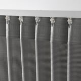 Five hanging sound-absorbing curtains with vertical white hooks, filtering light, creating folds for sound dampening.