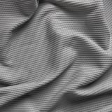Textured, gray, draped curtain close-up, soft, woven pattern, light filtering, sound absorption material.