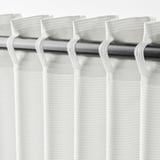 Close-up of white GUNNLAUG curtain with textured, sound-absorbing fabric on metal rod with hooks.