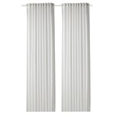 Two white GUNNLAUG curtains hang side by side. They feature a textured, sound-absorbing fabric design, ideal for light filtering and noise reduction.