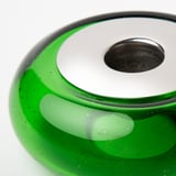 Green recycled glass candlestick with bubbly texture, mouth-blown craftsmanship.