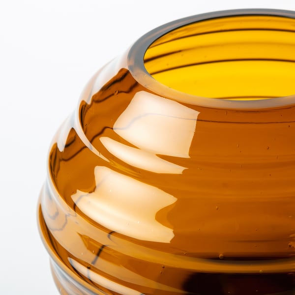 Handcrafted recycled glass vase, warm brown hue, subtle air bubbles, mouth-blown texture.