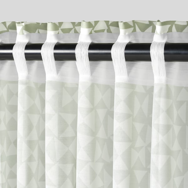 Green-white triangle pattern curtains with pleated heading for privacy and light filtering.