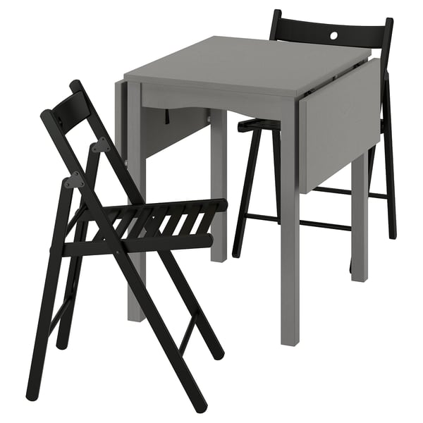 Gray HAUGA drop-leaf table with 2 foldable black frösvi chairs.