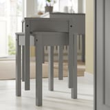 Gray HAUGA drop-leaf tables and stools in minimalist space. Modern, light wood, space-saving.