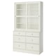 HAVSTA: white, wooden cabinet with six drawers and glass sliding doors, showcasing a rustic, elegant design.