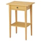 Option: Small yellow side table with drawer & shelf, bedroom/living room.