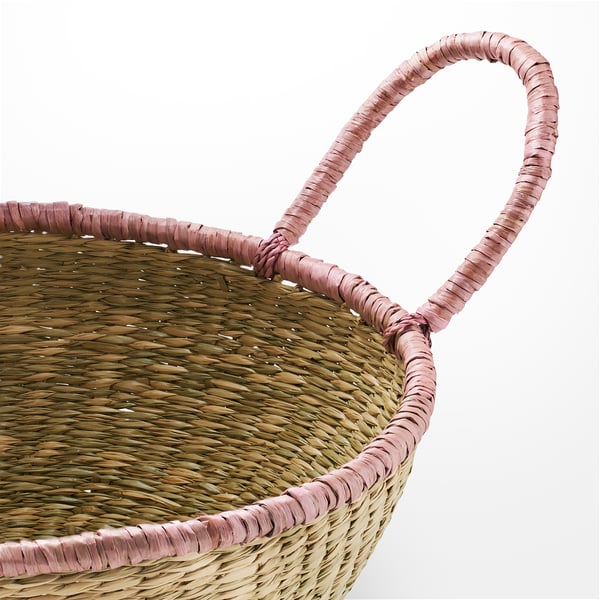 Handcrafted woven basket with sturdy handles, made from natural sedge material. Displaying intricate texture and craftsmanship.