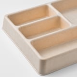 Small beige organizer with four compartments. Made from molded paper pulp. Ideal for desk or drawer use.