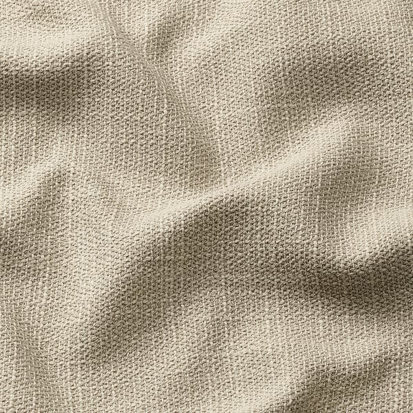 Close-up of textured fabric, likely furniture cover, showcasing intricate weave and light shade variations.