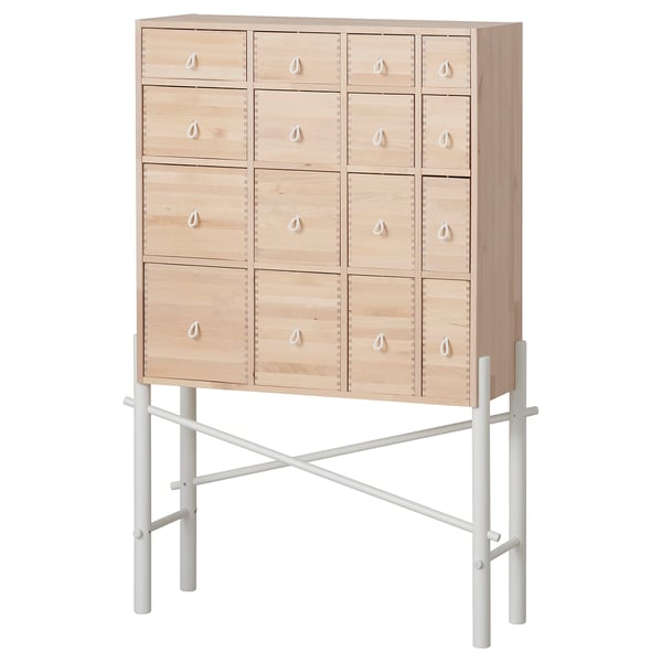 Light-colored wooden cabinet with 12 drawers and metallic legs; minimalist design.