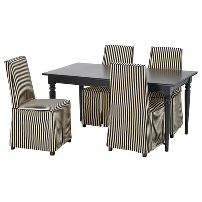 Black extendable dining table with four striped chairs. Modern design, sturdy wood, comfort seating.