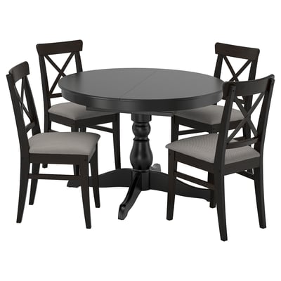 Round black INGATORP dining set with 4 cushioned chairs, x-back design.