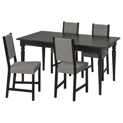 INGATORP: black extendable dining table with four grey fabric chairs. Modern, minimalist design.