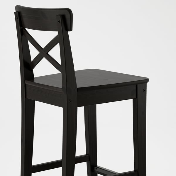 Black wooden bar stool with high back designed for comfort. Solid pine construction ensures durability and style.