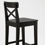 Black wooden bar stool with high back designed for comfort. Solid pine construction ensures durability and style.
