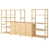 IVAR light wood storage shelves with cabinets.