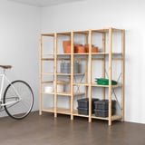 IVAR storage shelf: natural wood, holds terracotta pots, cans, and bins. Next to a white bike, large.