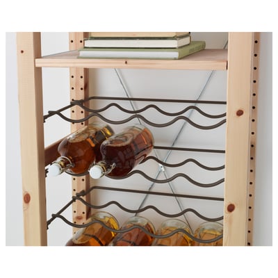 Wooden shelf unit with wine rack holding several bottles, topped with books.