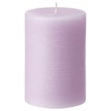 Light purple JÄMNMOD scented candle, cylindrical shape, made from plant-based wax.