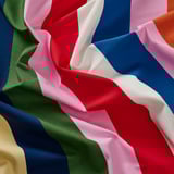 Vibrant striped cotton fabric, soft and colorful, ideal for crafting.