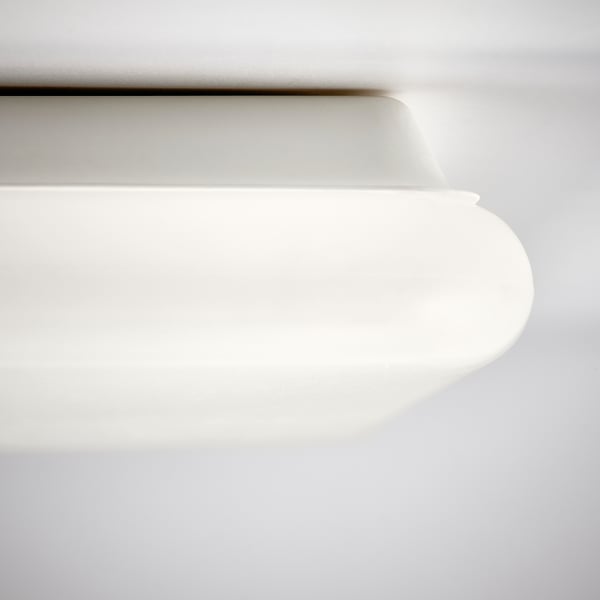 Modern white light panel, sleek design, smooth curves, flat surface.