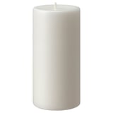 White JUBLA candle, cylindrical, smooth surface, made of stearin, unlit wick at top.