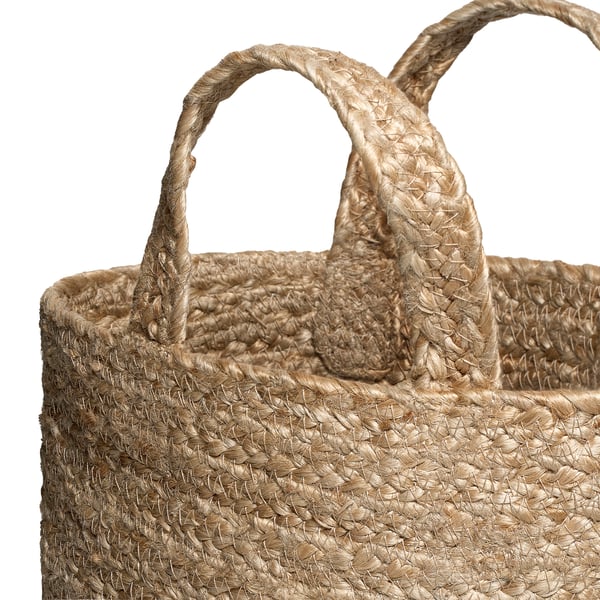 Handwoven jute basket with thick, sturdy handles, showcasing natural texture and quality craftsmanship.
