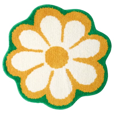 Flower-shaped green and yellow bath mat, soft and warm, machine washable.
